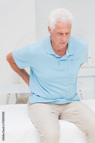 Senior patient suffering from backache