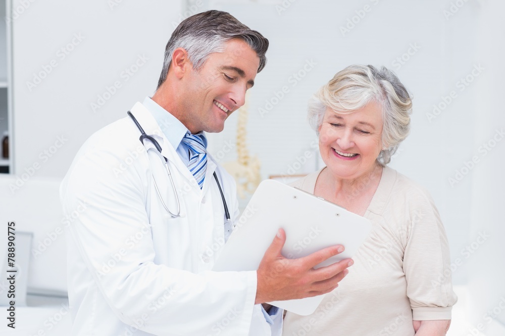 Doctor and patient discussing over reports Doctor and patient discussing over reports