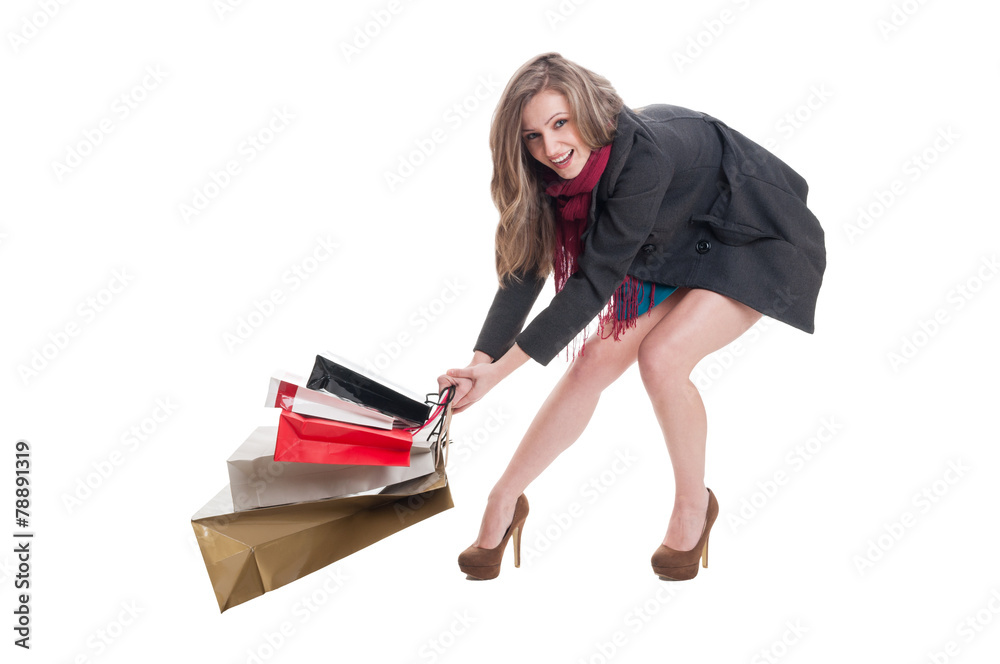 Fototapeta premium Happy shopping lady dragging heavy bags