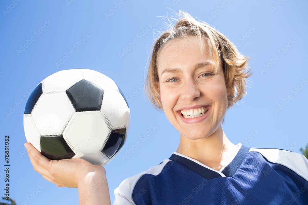 Pretty football player smiling at camera Pretty football player smiling at camera