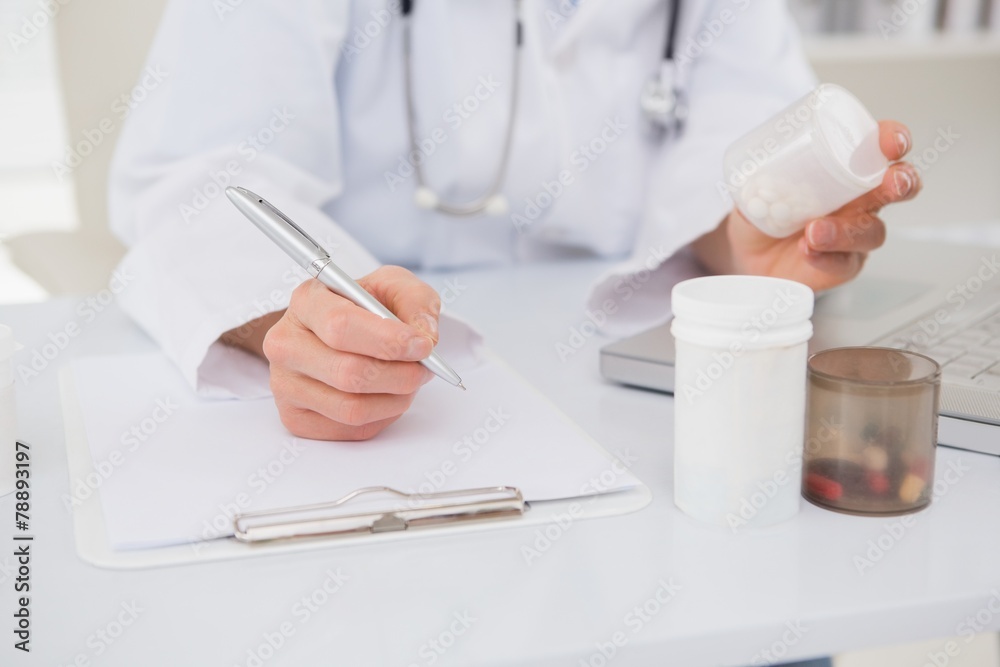 Veterinarian typing on keyboard the prescriptions Veterinarian typing on keyboard the prescriptions
