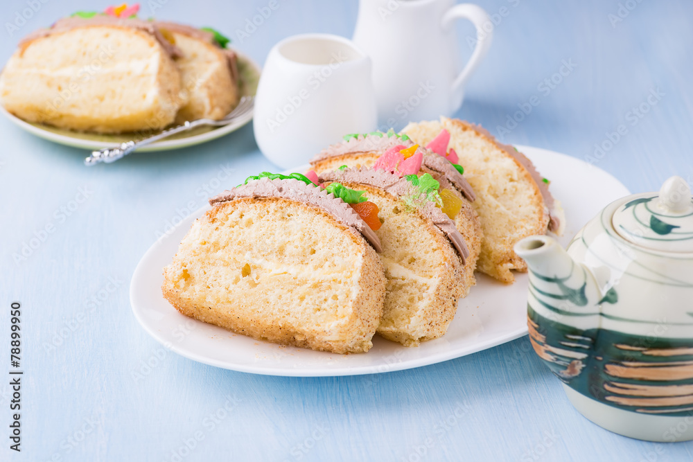 Slices of sponge cake with buttercream on plate