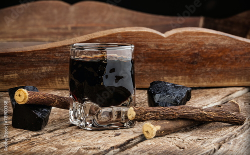 Licorice liqueur with pure blocks and roots.