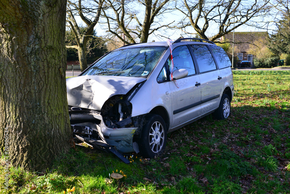 A head on car crash into a tree in Horley, Surrey in winter. A head on car crash into a tree in Horley, Surrey in winter.