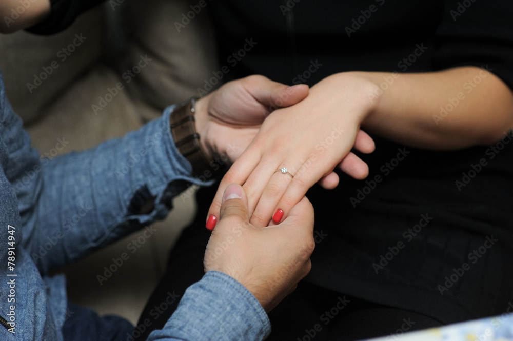 just engaged couple holding hands at restaurant