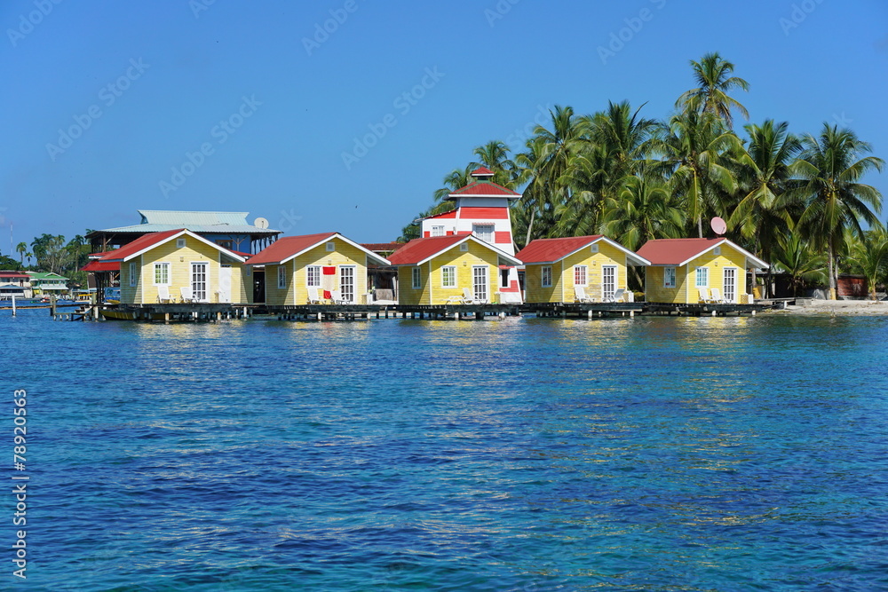 Tropical cabins over water of the Caribbean sea