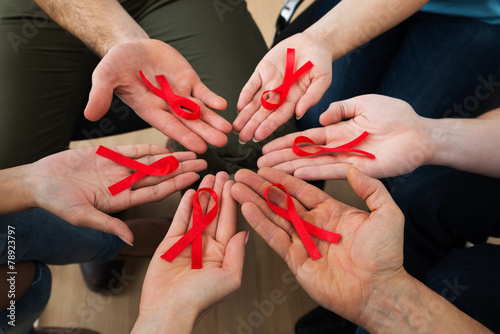 People Holding Aids Ribbon