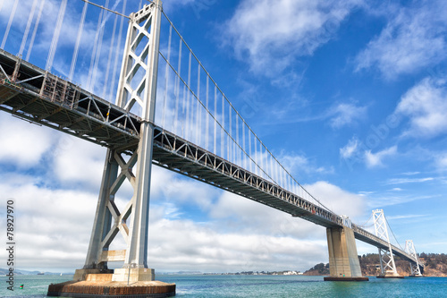 Fototapeta Naklejka Na Ścianę i Meble -  San Francisco Oakland Bay Bridge on a sunny day with clouds