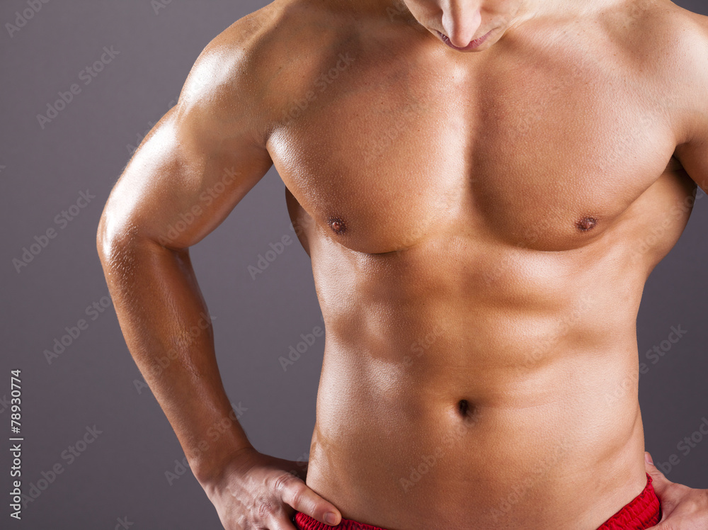 Beautiful man torso on grey background