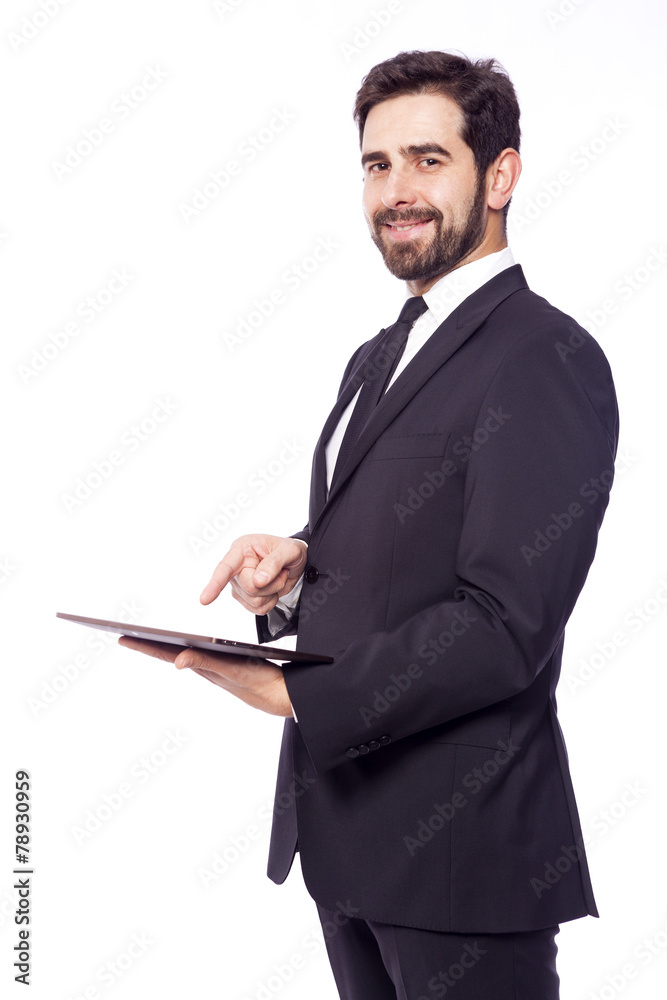 Businessman standing with a tablet computer, isolated on a white Businessman standing with a tablet computer, isolated on a white
