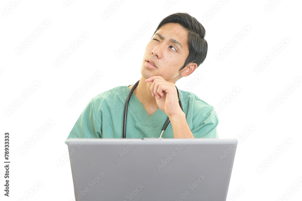 苦悩する医師