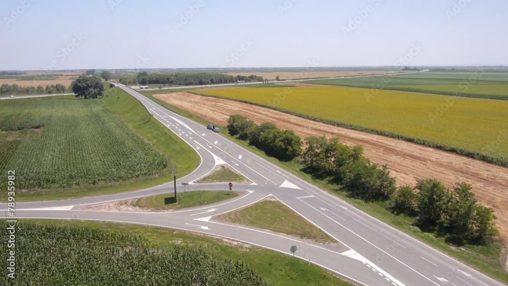 Aerial view on the roads, highway and agriculture fields close t Aerial view on the roads, highway and agriculture fields close t