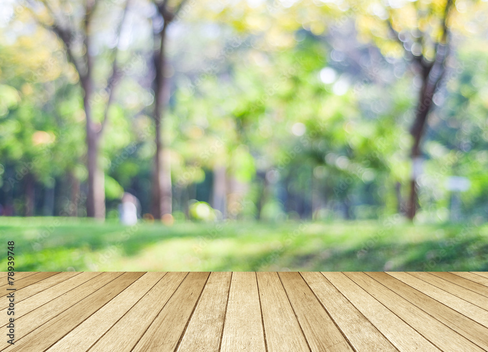 Perspective wood over blur trees with bokeh background Perspective wood over blur trees with bokeh background