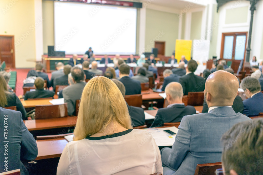 Fototapeta premium people sitting rear at the business conference