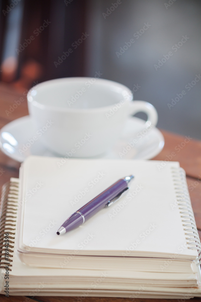 Blank notebook with pen on wooden table Blank notebook with pen on wooden table