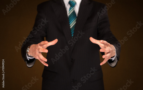 Businessman holding something