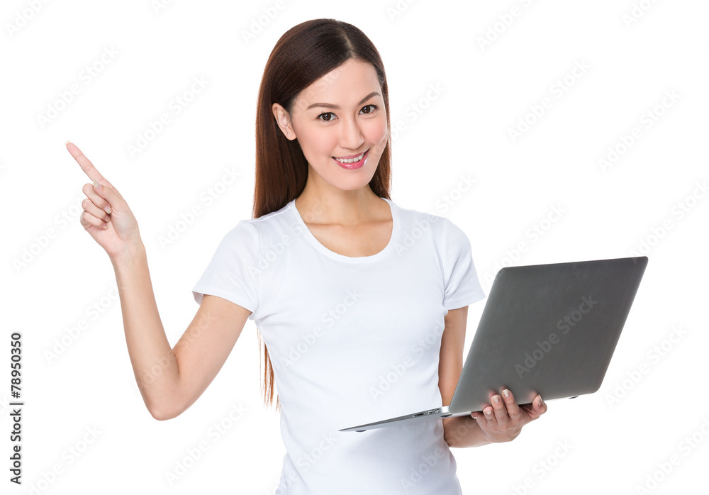 Woman hold with laptop and finger point up Woman hold with laptop and finger point up