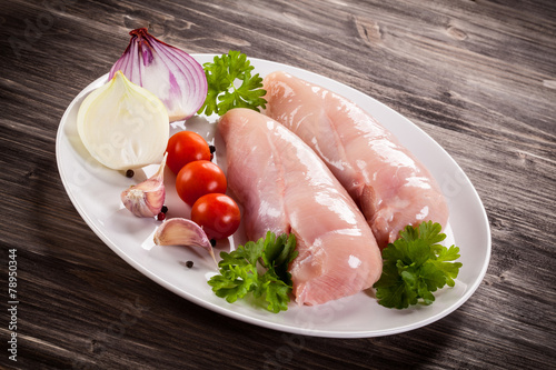 Raw chicken fillets photo