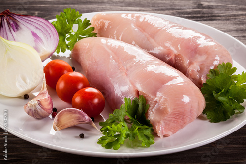 Raw chicken fillets photo