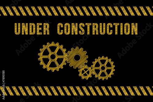 Under construction road sign in yellow on black with stripes