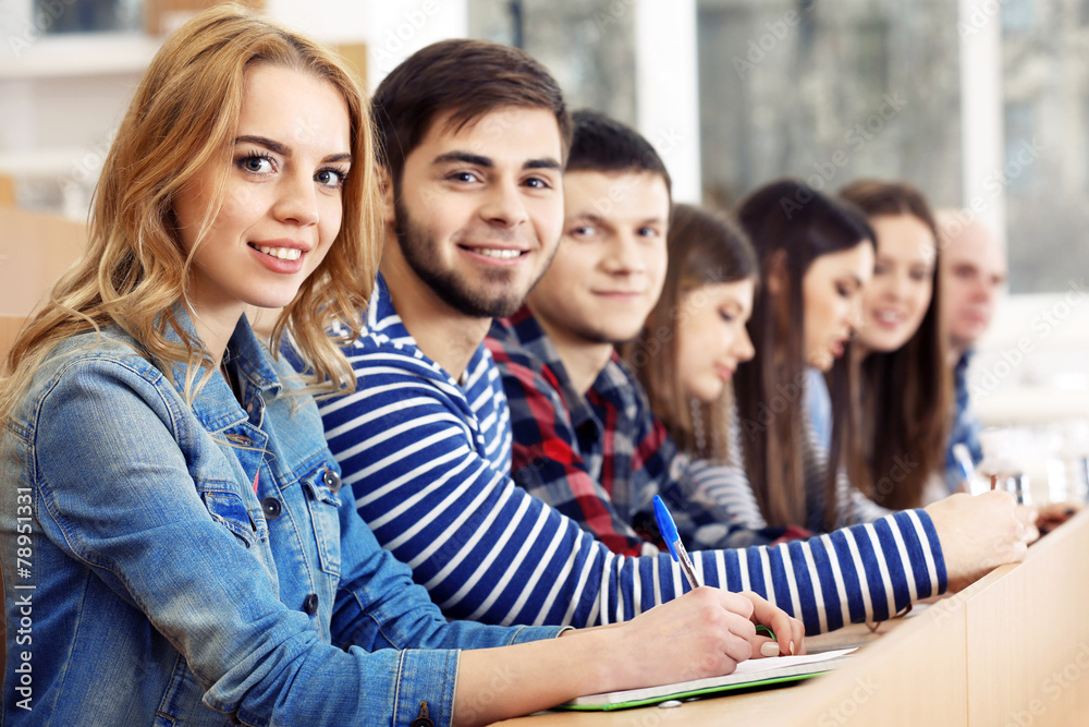 Group of students sitting in classroom Group of students sitting in classroom