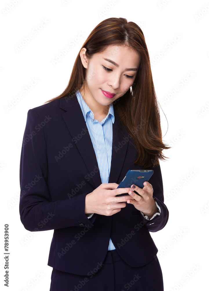 Businesswoman look at the cellphone Businesswoman look at the cellphone