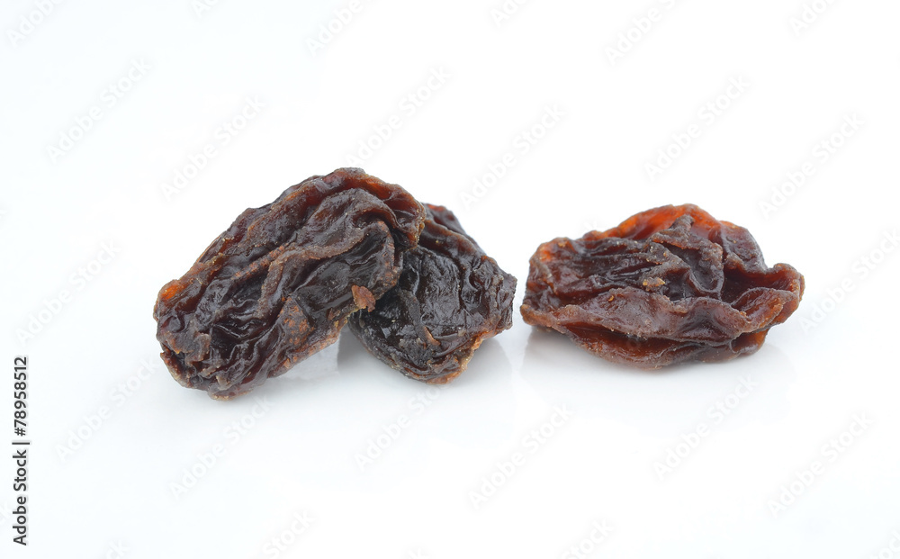 Dried raisins on a white background Dried raisins on a white background