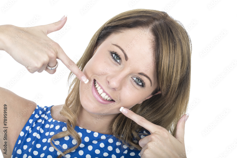 Young Woman Wearing Blue Polka Dot Dress Pointing at Teeth Young Woman Wearing Blue Polka Dot Dress Pointing at Teeth