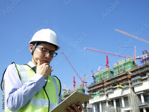 Construction worker using tablet