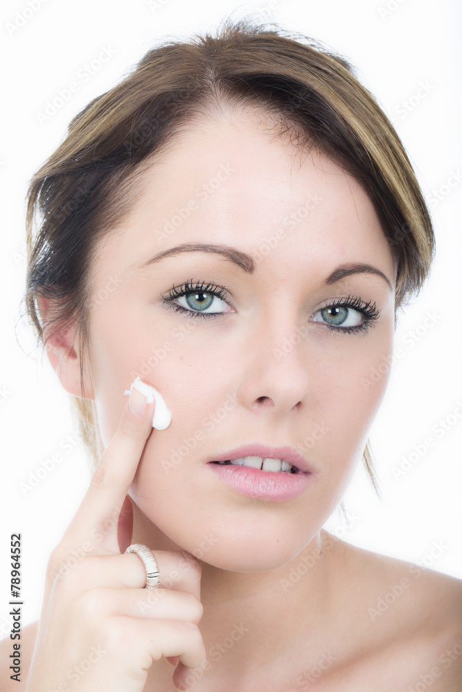 Attractive Young Woman Applying Moisturizing Cream