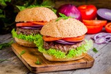 two homemade hamburgers with fresh organic vegetables