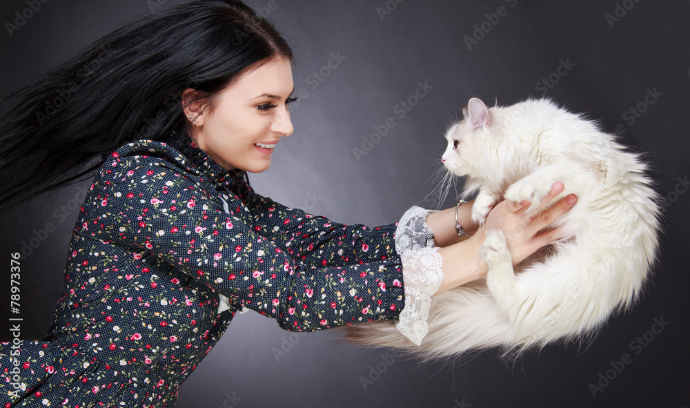 Young attractive woman playing with a cat Young attractive woman playing with a cat