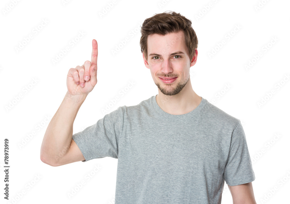 Young man with finger point upwards Young man with finger point upwards