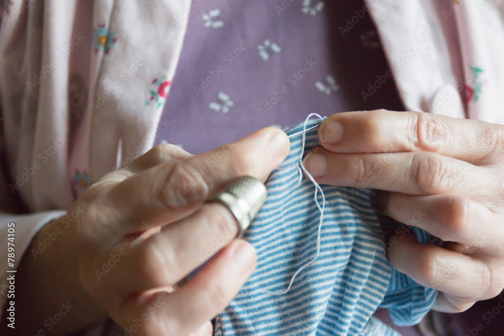 hemming a dress, woman hands needlework
