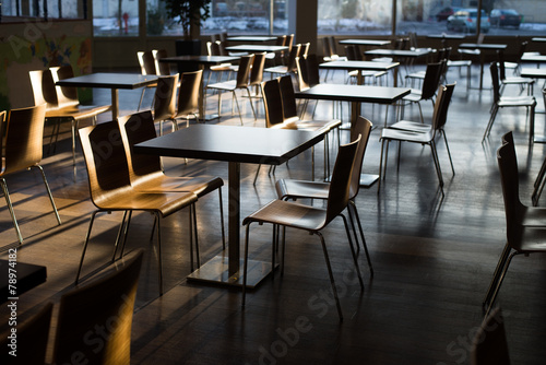 Empty fast-food restaurant lit by morning sun