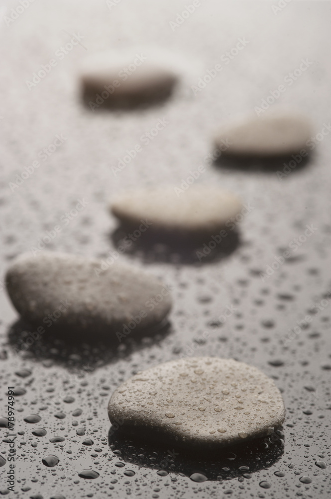 Spa massage stones with water drops, close up Spa massage stones with water drops, close up