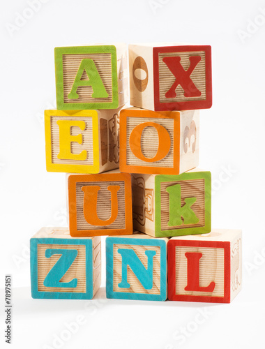 Colored Wooden Alphabet Blocks on White Background