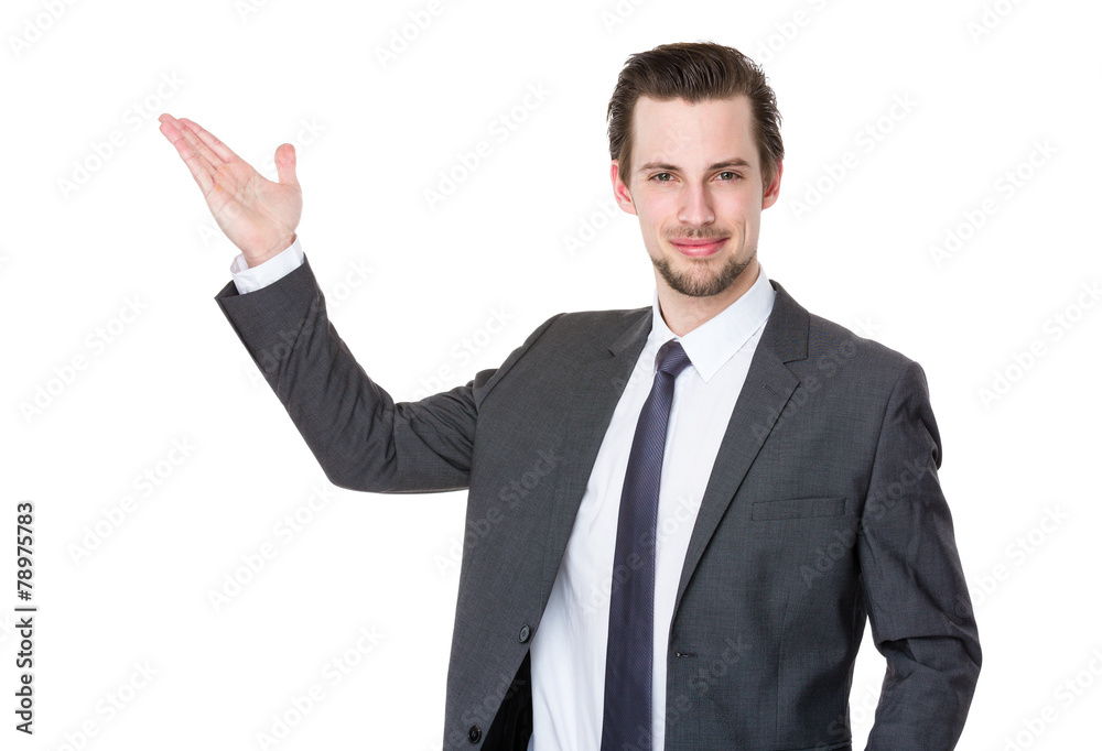 Caucasian businessman with hand present something Caucasian businessman with hand present something