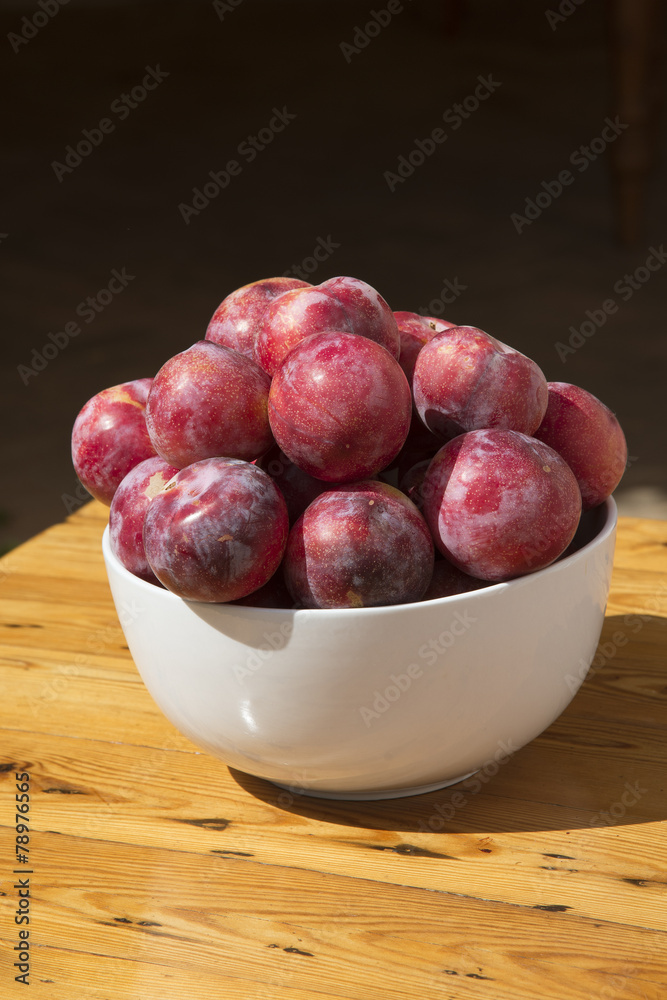 African sweet plums in a white bowl African sweet plums in a white bowl