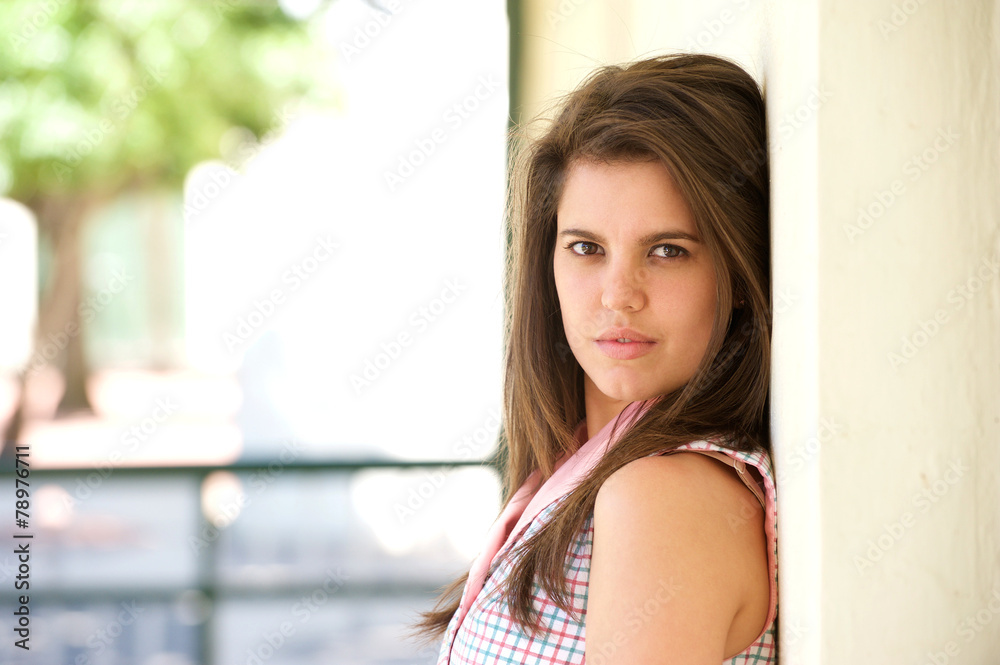Attractive young woman posing outside