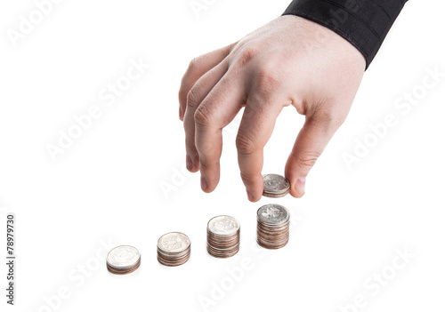 stack of coins and human hand