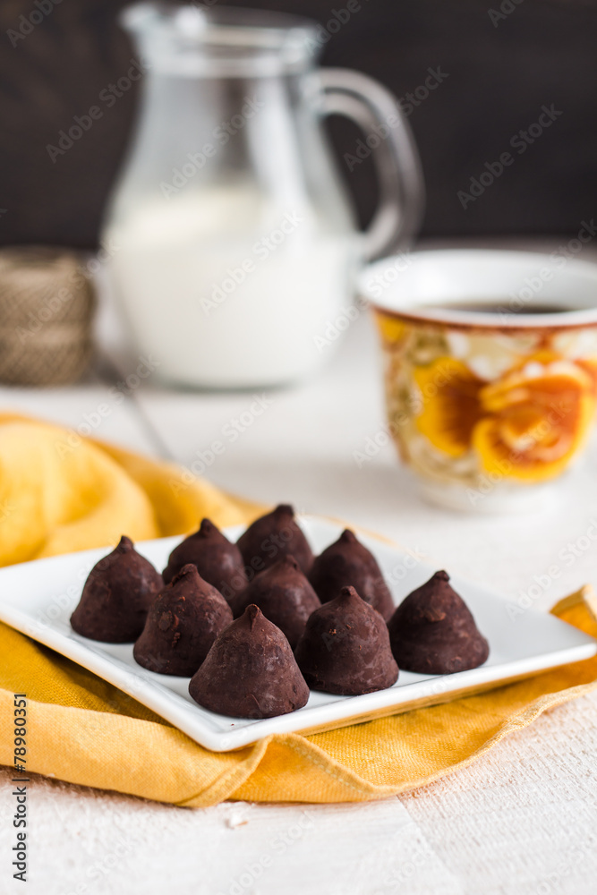 truffle chocolates with a cup of coffee and cream truffle chocolates with a cup of coffee and cream