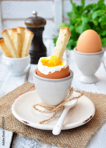 boiled egg for breakfast on a wooden table
