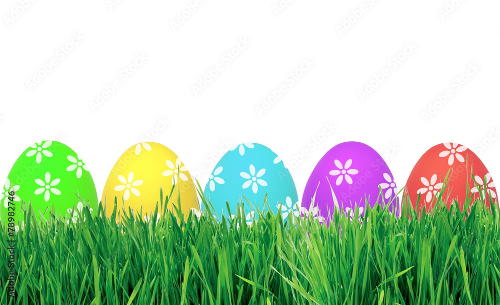 Easter eggs in green grass isolated on white Easter eggs in green grass isolated on white