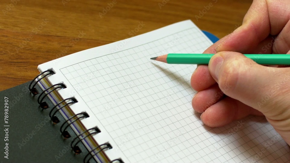 A man writes in pencil chemical formula A man writes in pencil chemical formula