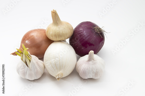 fresh vegetables garlic and onions isolated on the white