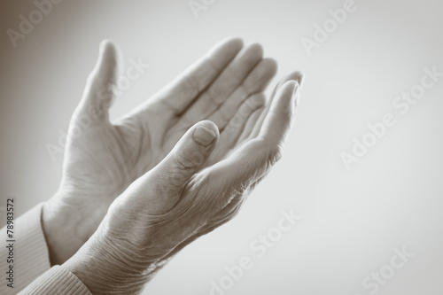 Hands of old woman in shades of grey