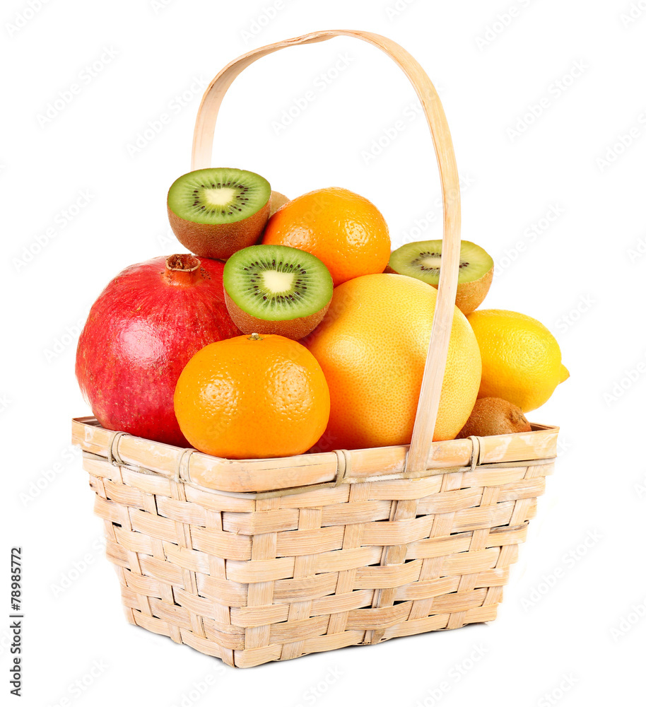 Assortment of fruits in basket isolated on white