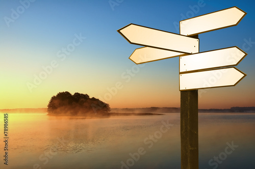Guidepost on a lakeshore