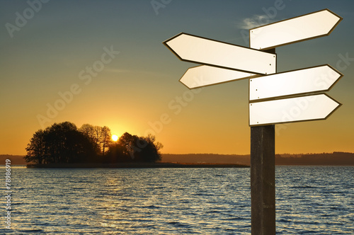 Guidepost on a lakeshore